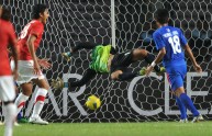 Cambodia goal keeper Sou Yaty fails to b