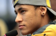 Brazilian striker Neymar listens to a qu