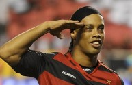 Brazilian footballer Ronaldinho greets f